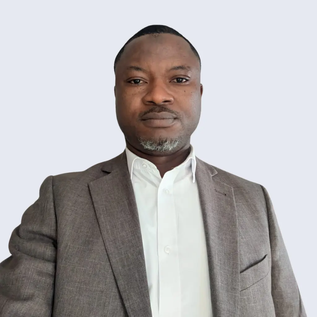 Portrait of Azeez Iyanda, Managing Director at BV Integrated Ltd, wearing a grey suit with a plain background